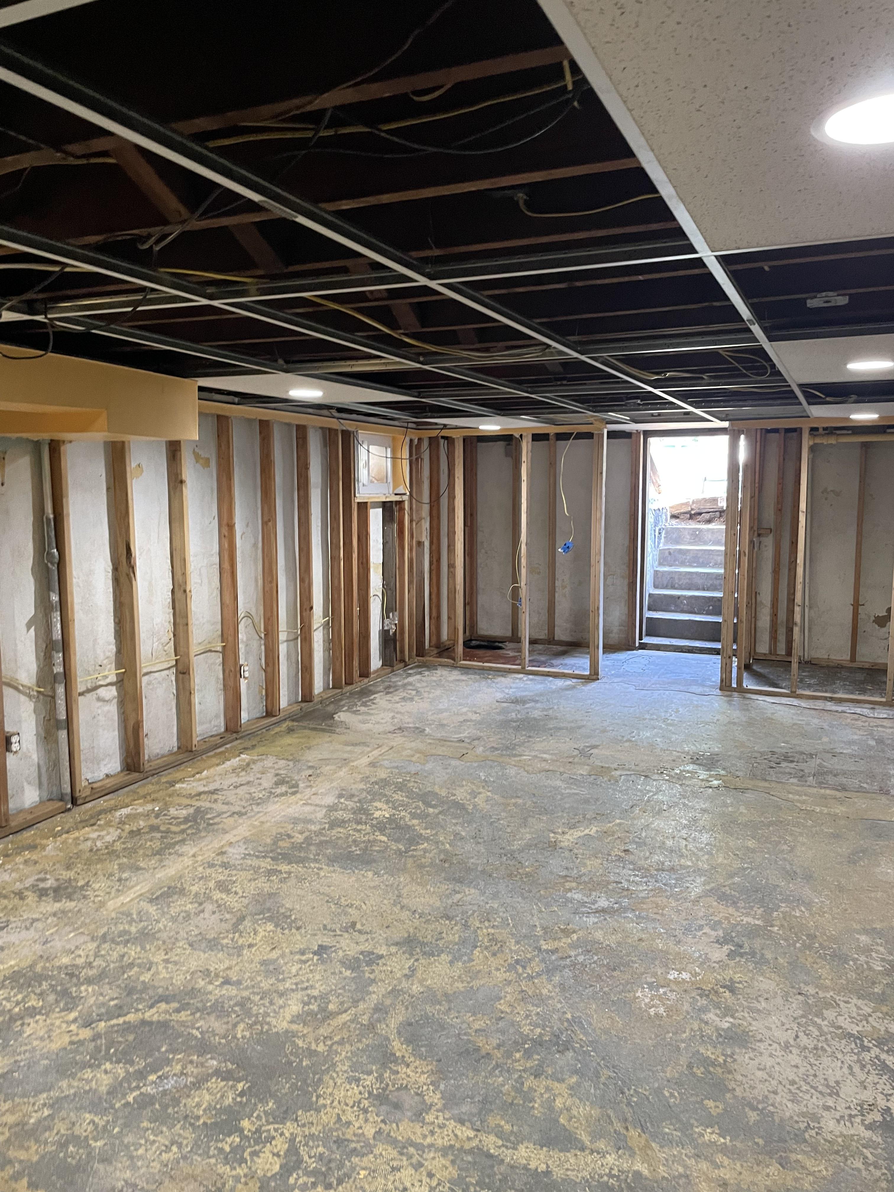 Drywall demolition exposing water damage in a New Jersey residential property