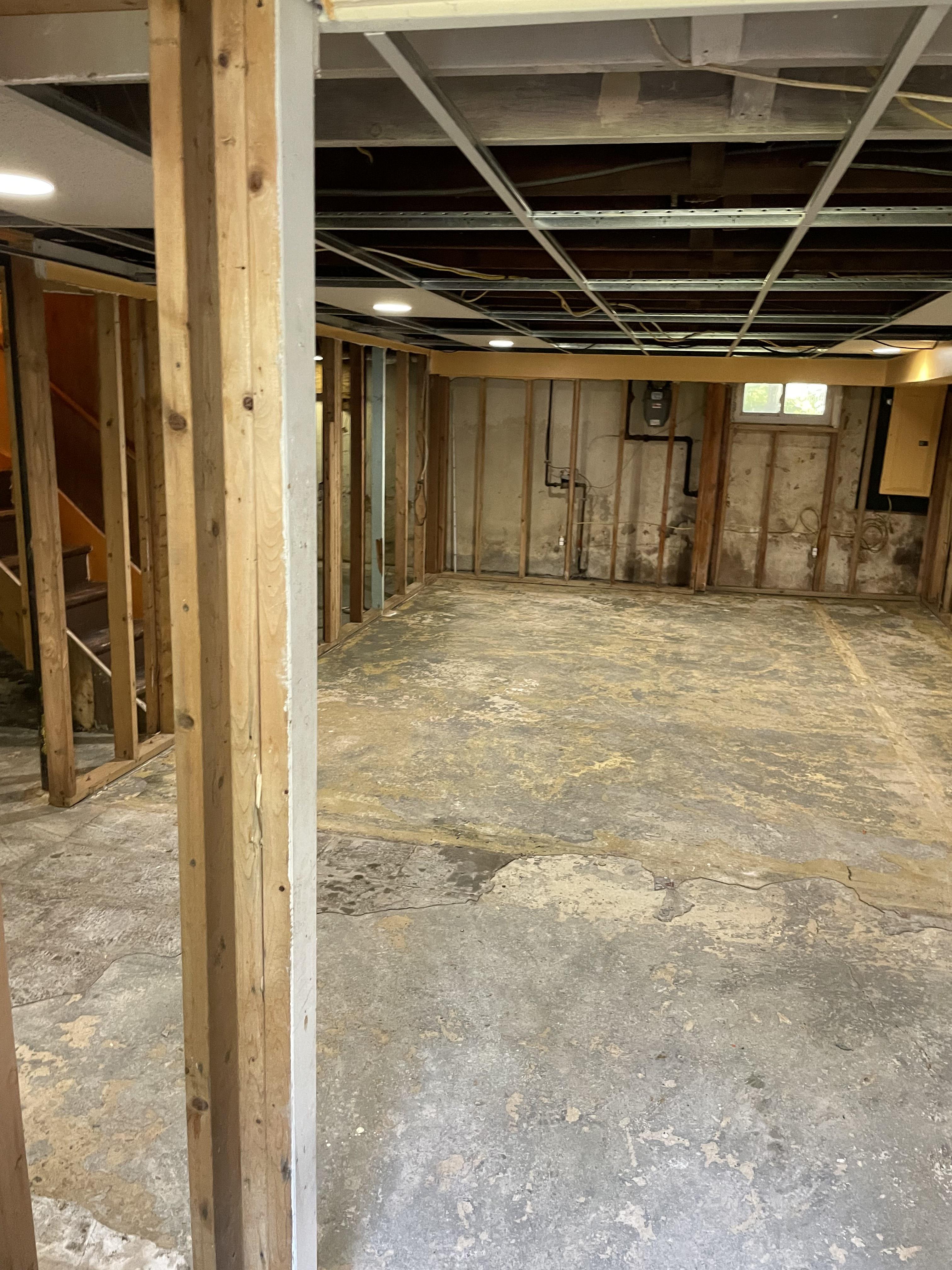 Water-damaged floor removal and restoration work in a New Jersey home